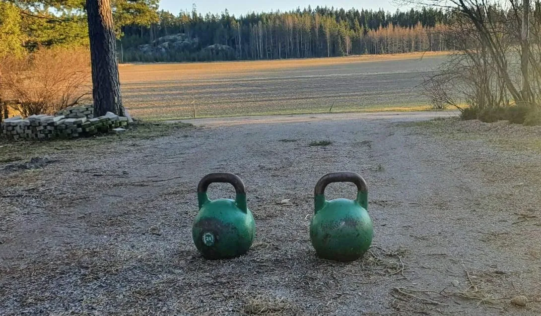 Kettlebells on the floor of a home gym